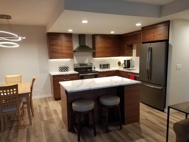 Downtown Boise condo kitchen remodel with flat panel walnut cabinets