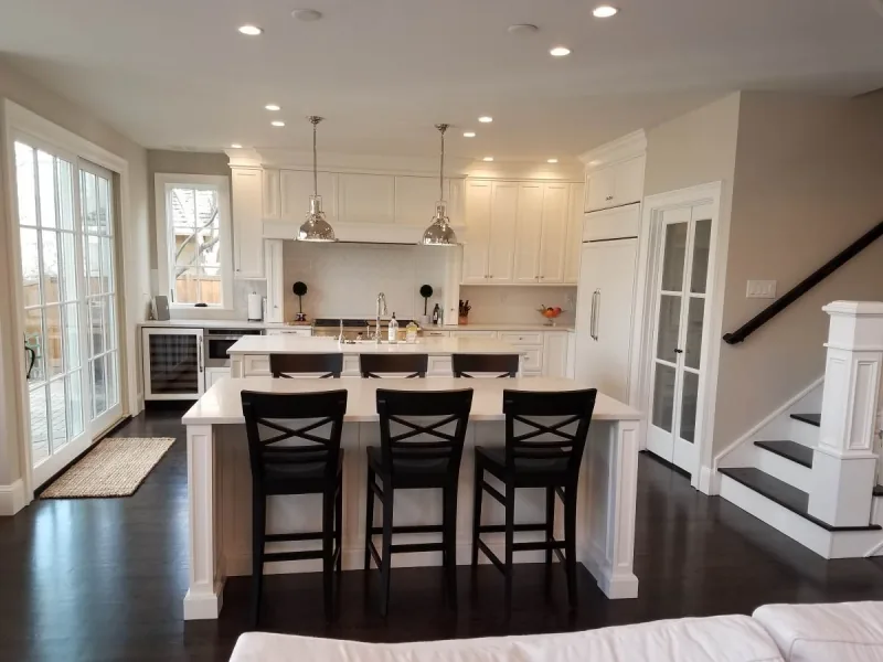 White kitchen with two custom islands